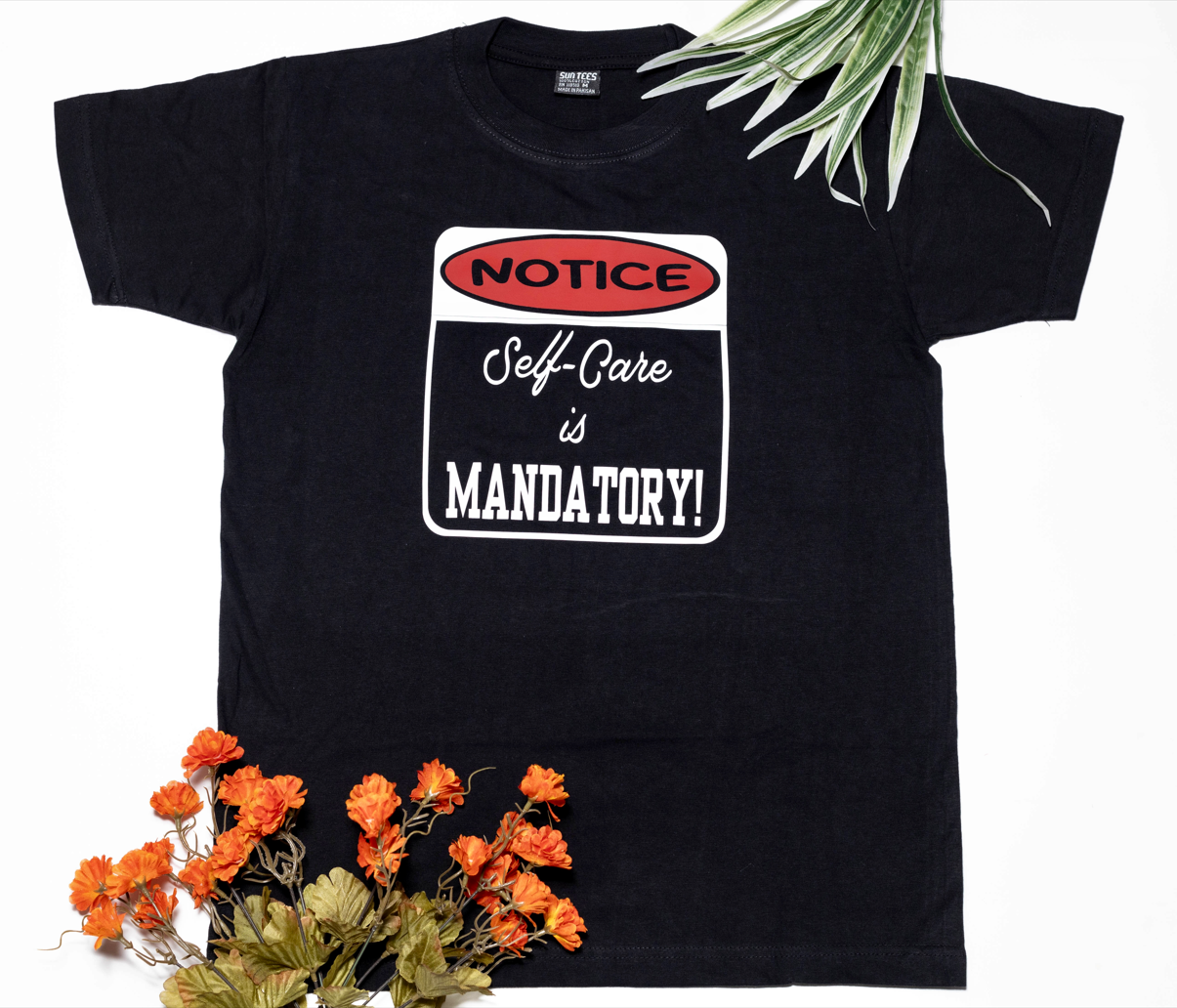 Short sleeve black t-shirt, with a very important notice: Self-Care is Mandatory!