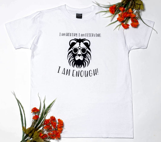Short sleeve white t-shirt, with empowering statement: I am Worthy. I am Deserving. I am Enough! surrounding a confident lion with glasse
